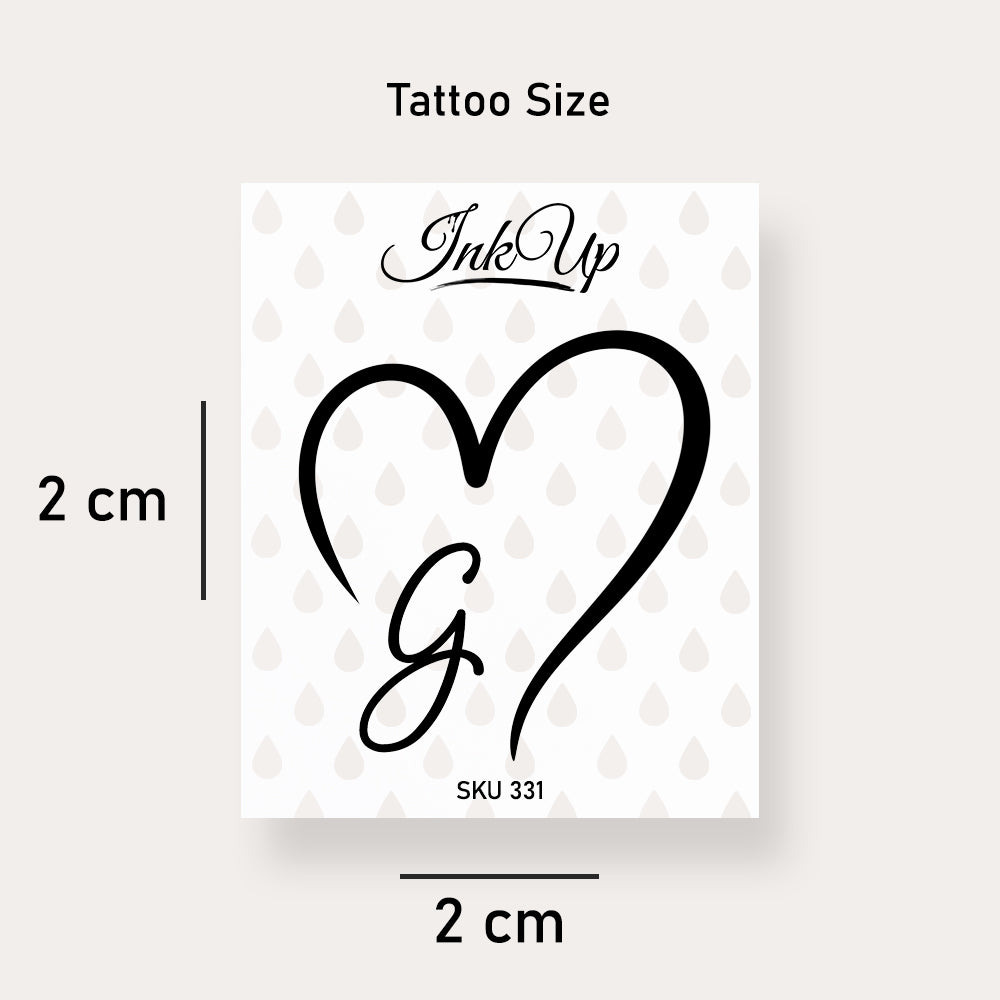 G letter heart tattoo